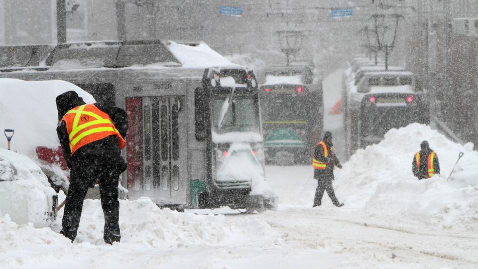 (020913 Boston, MA) MBTA workers  are seen during snow storm around Cleveland Circle area in Boston's Brighton neighborhood, Saturday, Feb. 9, 2013.    Photo by Chitose Suzuki