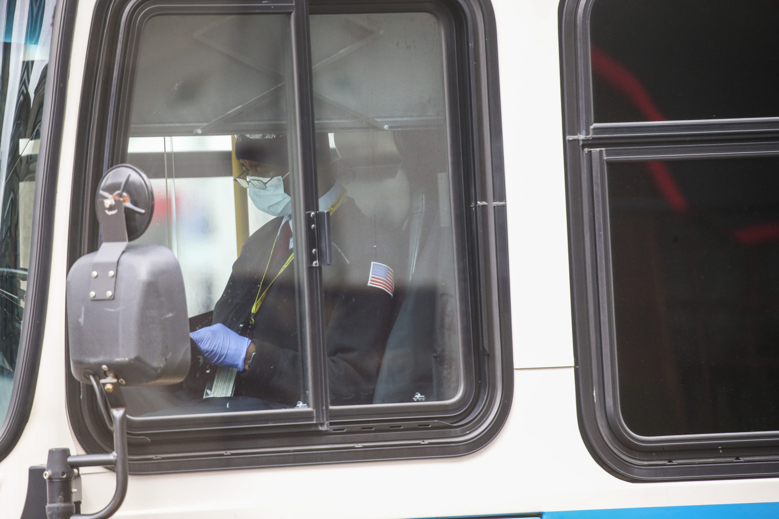 BOSTON, MA: March 25, 2020: An MBTA bus driver wears a protective mask and gloves in Boston, Massachusetts. (Staff photo by Nicolaus Czarnecki/MediaNews Group/Boston Herald)